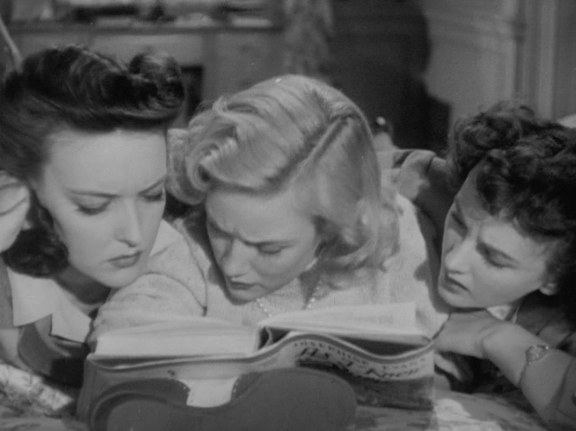 3 girls engrossed in Josephine Evans' latest novel.